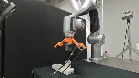 Robot aligning a USB plug with a charger